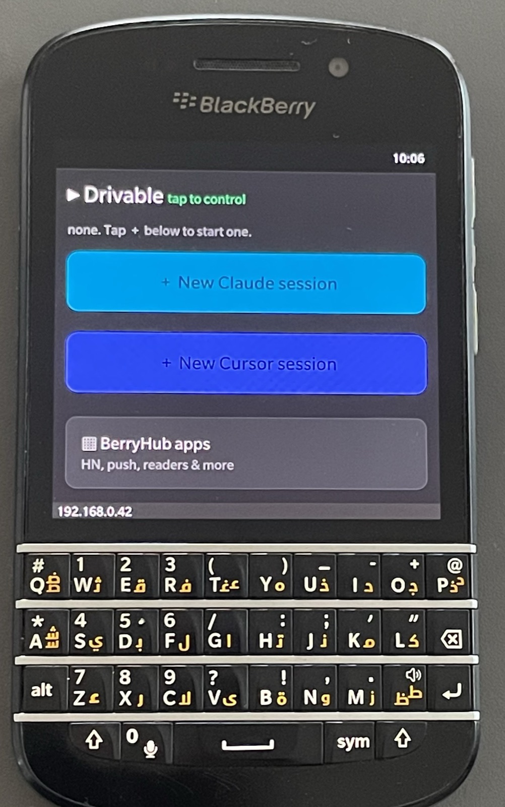A BlackBerry Q10 showing BerryHub's Drivable screen in the stock browser, with buttons for a new Claude session and a new Cursor session.